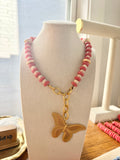 Butterfly necklace in sunset