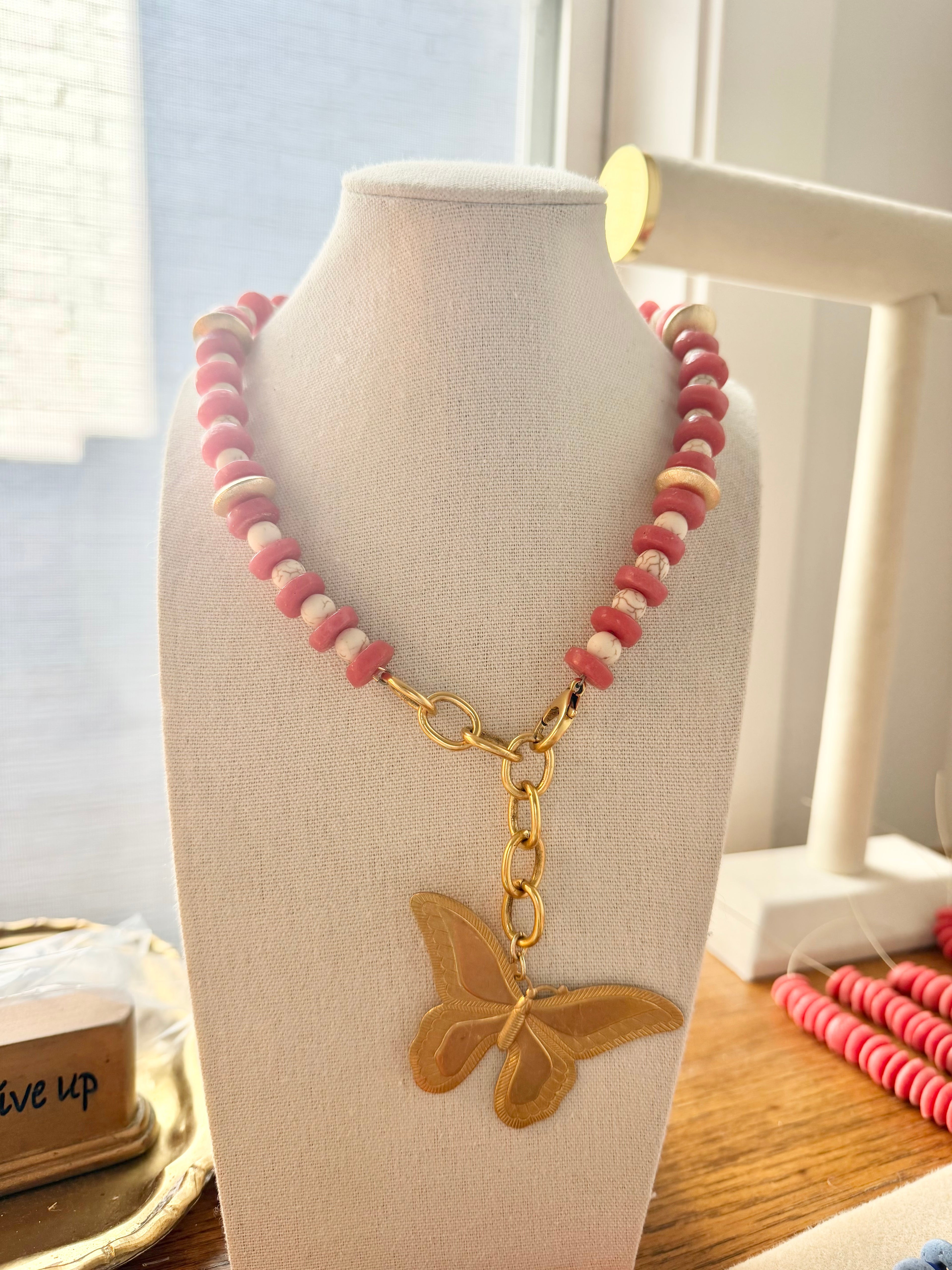 Butterfly necklace in sunset
